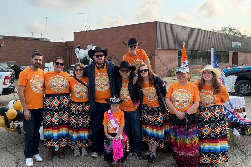 Blue Sky Research Lab members posing together in the Samson Cree Nation Powwow Celebration parade.