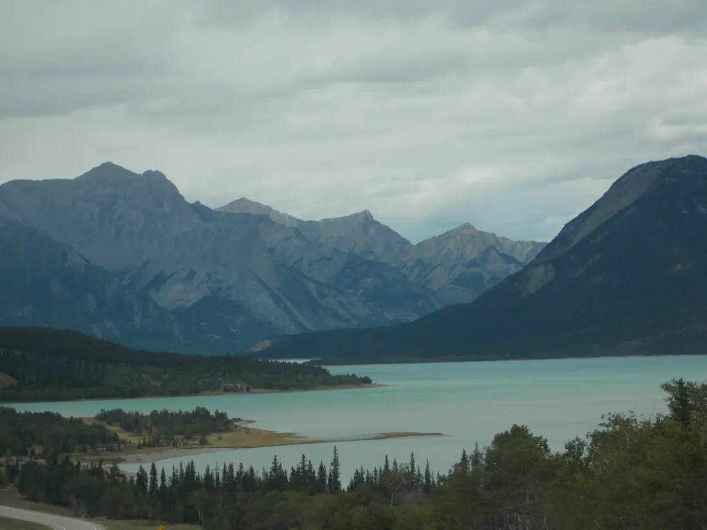 Temporary placeholder photograph of a mountain lake beneath a cloudy sky; not a photograph of the workshop