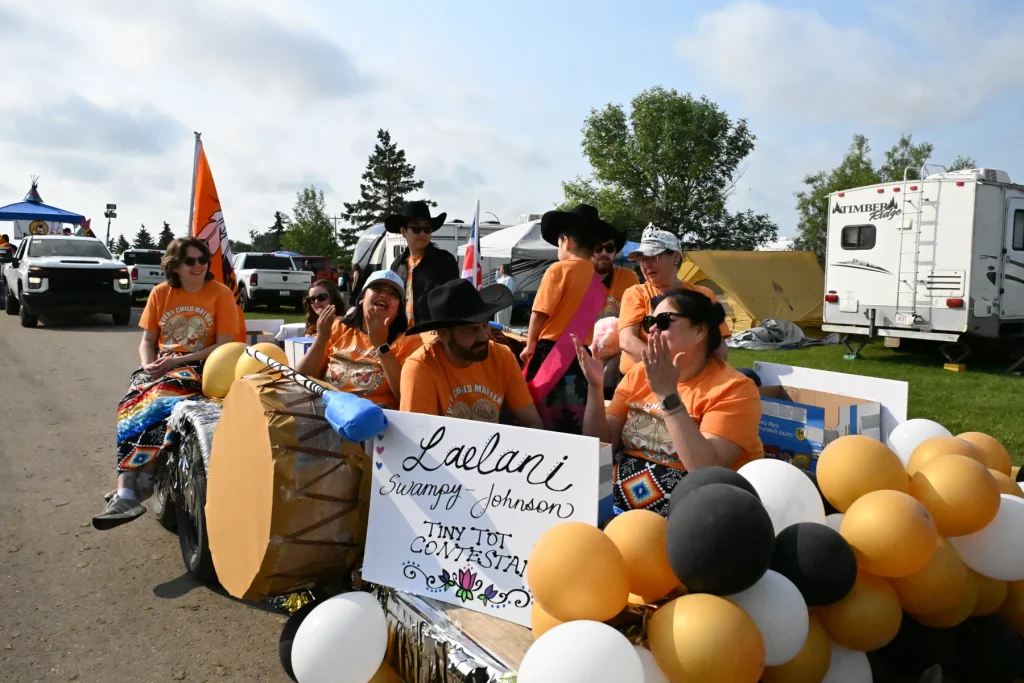 Blue Sky Research Lab members riding together in the Samson Cree Nation Powwow Celebration parade