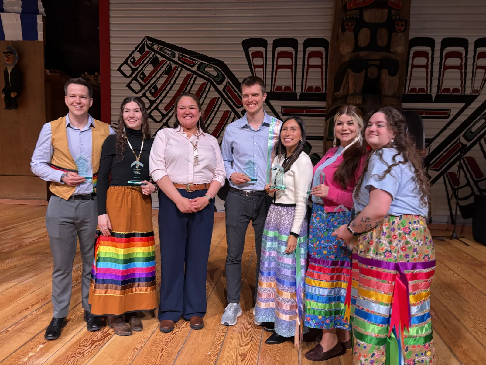 Blue Sky Research Lab members holding awards at the 2025 Braiding Knowledges Canada gathering